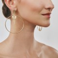 Asymmetrical, gold hoop earrings from the Holos HOK42-1 ORSKA collection
