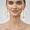 Large, gold hoop earrings from the Holos HOK42-1 ORSKA collection