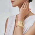 Wide, gold bracelet with gray crystal from the Holos HOA74-1 ORSKA collection