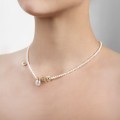 Handmade gold-plated pearl necklace with acorn-shaped pendants from the Bery collection by ORSKA jewelry