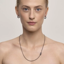 A delicate necklace with a geometric pendant from the Nepal collection