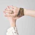 Leather hand bracelet from the Tattoo collection by ORSKA jewelry on the model Mela Koteluk