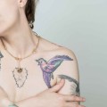 Subtle feminine necklace with a small tattoo from the Tattoo collection by ORSKA jewelry