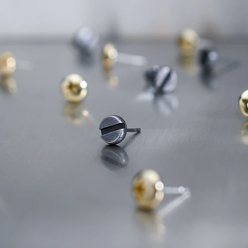 Small, screw-shaped stud earrings by ORSKA jewelry