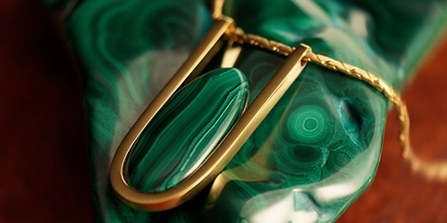 Gold necklace with green stone