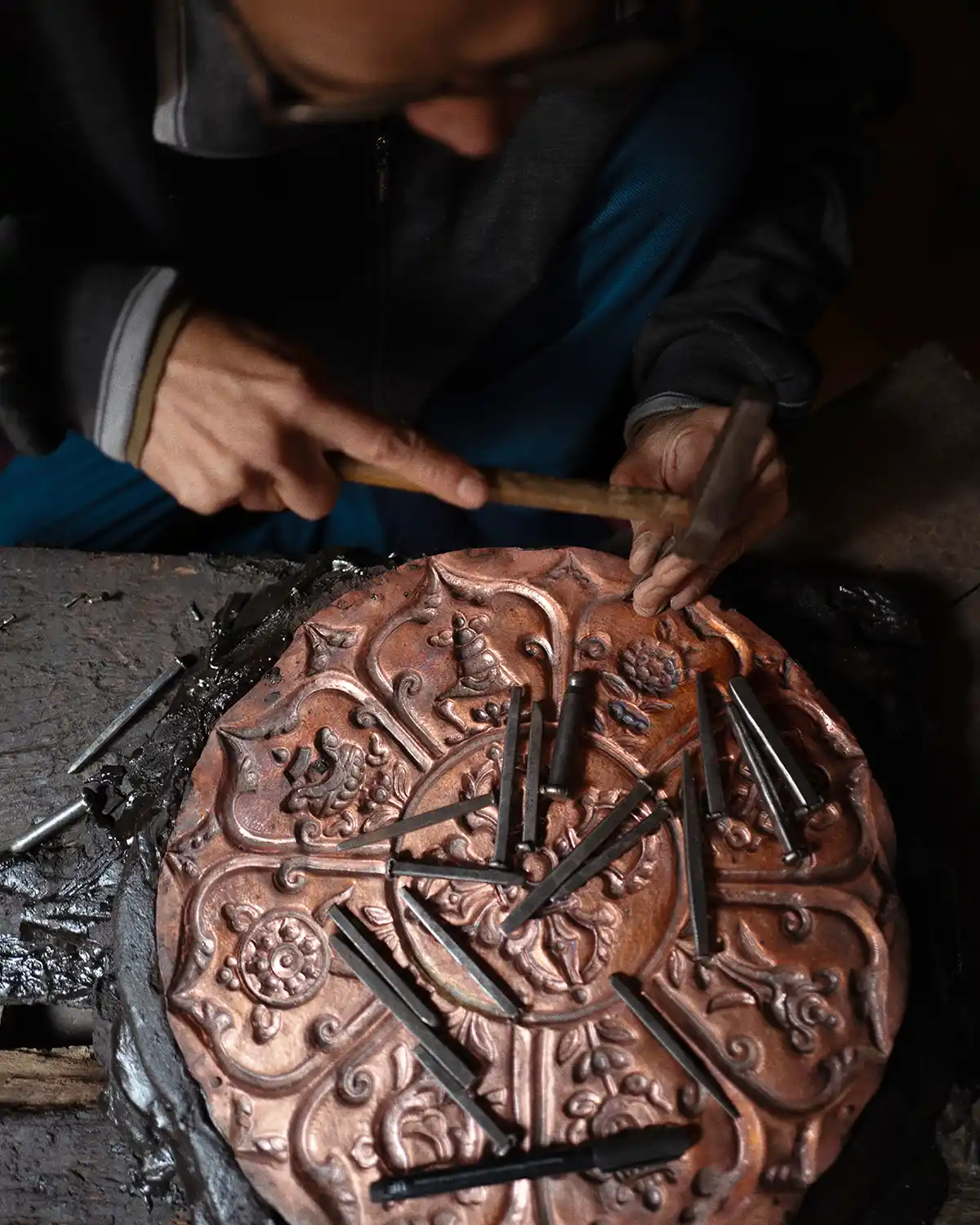Repoussé mandala work in Nepal