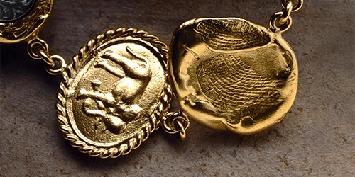 Silver and goldplated jewelry with sumbols